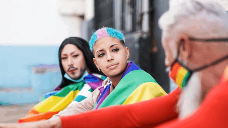 People wearing rainbow colors symbolic of support for the LGBTQIA2S+ community.